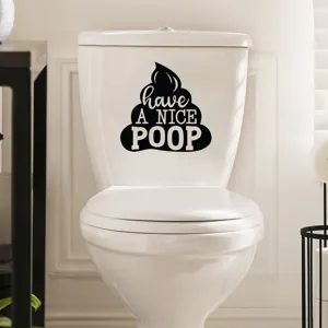 Close-up of funny black 'Have a Nice Poop' sticker applied on a white toilet water tank.