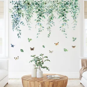 Green hanging leaf vines and butterfly wall stickers in a bright living room