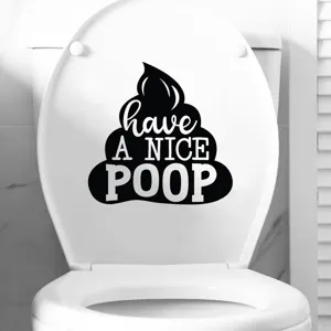 Close-up view of funny 'Have a Nice Poop' waterproof sticker on a white toilet seat lid