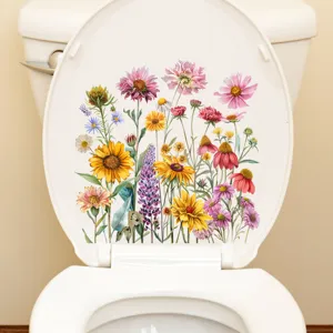 Macrodetail van kleurrijke zonnebloem- en wilde bloemenstickers op een toiletbril-deksel
