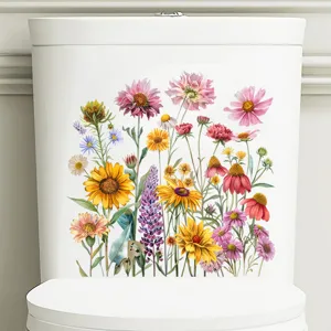 Detailopname van kleurrijke zonnebloem bloemenstickers op een wit toiletreservoir
