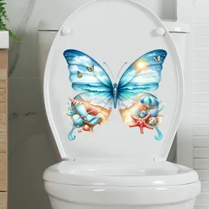 Butterfly shaped beach scenery sticker applied on a white toilet lid for bathroom decoration