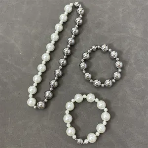 Close-up detail of luxury pearl and silver bead necklace set with magnetic clasps