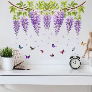 Purple wisteria vine and butterfly wall stickers applied on a white wall in a study setting.