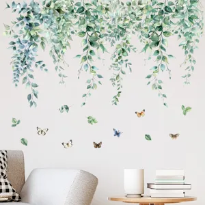 Watercolor green vine and butterfly wall decals for modern living room wall decor.
