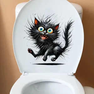 Detailansicht eines lustigen Aufklebers mit einer schwarzen Katze auf einem Toilettendeckel