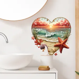 Heart-shaped beach sunset wall sticker displayed in a bright modern bathroom setting.
