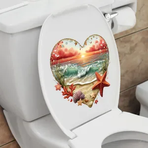 Close-up of heart-shaped beach scene sticker applied on a white toilet lid
