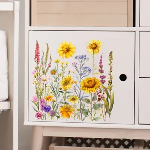 Gedetailleerd overzicht van decoratieve aquarel zonnebloemstickers op witte kast