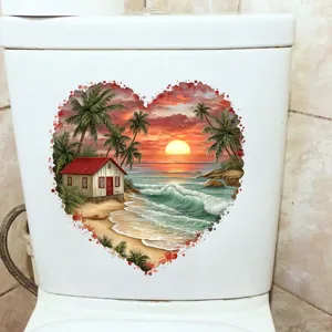 Heart-shaped tropical beach sunset sticker applied on a white ceramic toilet tank.