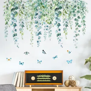 Detailed view of watercolor green vine and butterfly wall stickers in a living room