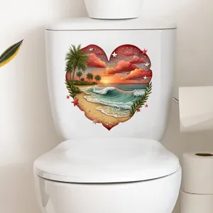 Detailed view of a waterproof heart-shaped beach sunset sticker on a white toilet tank