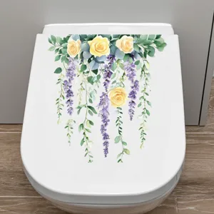 Detailed view of floral toilet lid sticker with yellow roses and purple wisteria.