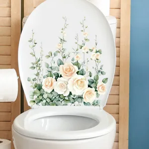 Close-up view of a waterproof floral toilet lid decal with cream roses and leaves
