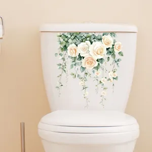 Elegant white roses and green vine floral wall sticker applied to a bathroom toilet tank