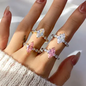 Close-up detail of marquise-cut pink and clear cubic zirconia rings shown on hand