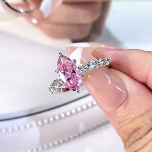 Macro view of a stunning pink marquise-cut zircon ring with brilliant claw setting