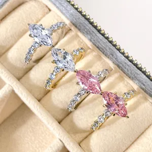 Detailed view of luxury marquise-cut pink and clear zirconia rings in a jewelry box