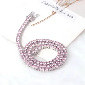 Close-up of pink round-cut tennis necklace with elegant silver-toned setting