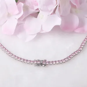 Detailed close-up view of an elegant pink tennis necklace with a secure fold-over clasp