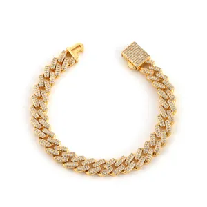 Iced out double-row Cuban link chain in gold finish with sparkling cubic zirconia.