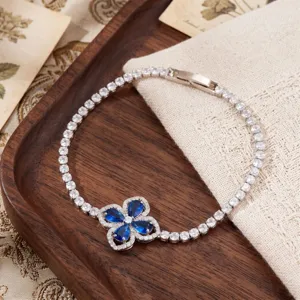 Silver four leaf clover tennis bracelet with blue cubic zirconia stones for women gift.