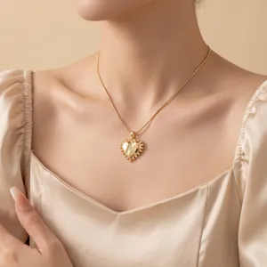 Elegant gold heart pendant necklace, delicate clavicle chain for women daily wear.