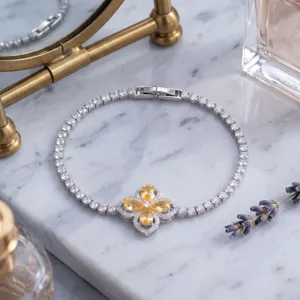 Exquisite silver tennis bracelet with yellow clover charm and sparkling crystals for women