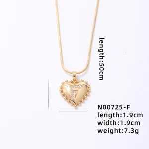 Gold heart letter F pendant necklace with snake chain, elegant fashion jewelry for women.