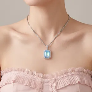Close-up of elegant square iridescent zirconia pendant necklace on a model.