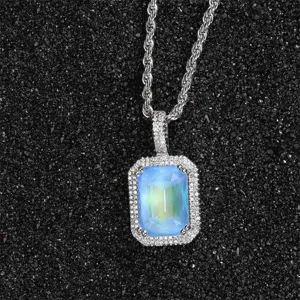 Close-up detail of luxury square fluorescent zircon pendant with silver rope chain necklace