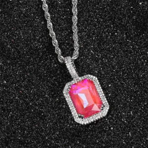 Detailed macro view of a fluorescent pink square zircon pendant necklace with pave setting