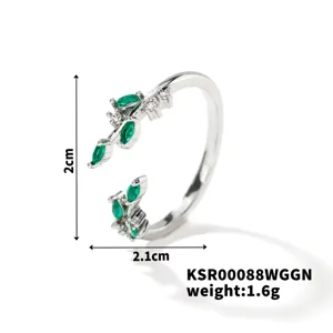 Close-up detail of silver open ring featuring green leaf marquise zirconia stones and clear accents.