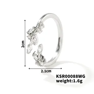 Close-up detail of the silver leaf open ring, sparkling cubic zirconia stones, exquisite design.