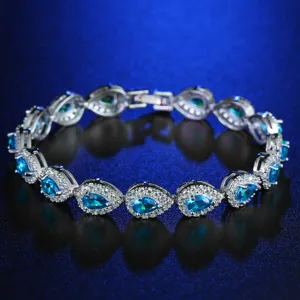 Close-up of elegant teardrop blue cubic zirconia bracelet with sparkly halo stones
