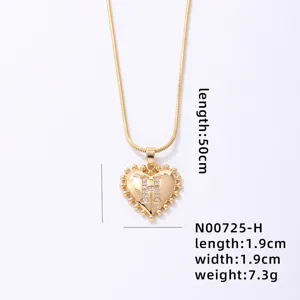 Gold-plated initial heart pendant necklace featuring shimmering cubic zirconia letter H.