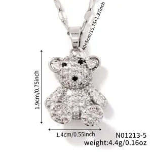 Close-up detail of sparkling zircon crystal teddy bear pendant necklace with dimensions.