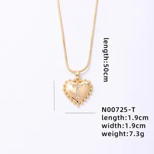 Gold heart letter T pendant necklace with beaded edge detail and chain, elegant fashion jewelry.
