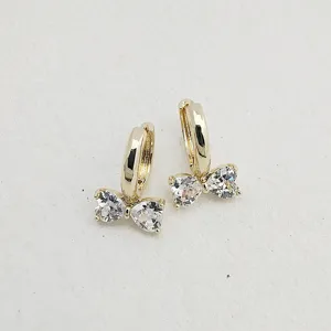 Gold-plated hoop earrings featuring sweet heart-shaped cubic zirconia bow details.