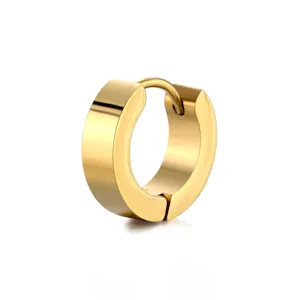 Close-up detail of polished gold titanium steel hoop earring, smooth texture, modern design.