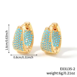 Detailed view of gold U-shaped hoop earrings with turquoise beads and size measurements