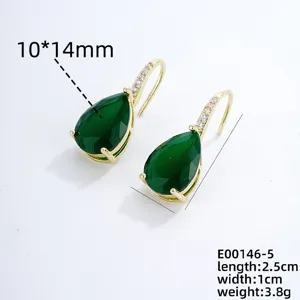 Elegant teardrop green gemstone earrings detail view, featuring sparkling cubic zirconia pave hooks.