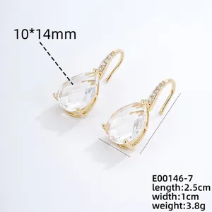 Detailed view of elegant teardrop zircon earrings with micro-pave hook, stunning gold jewelry.