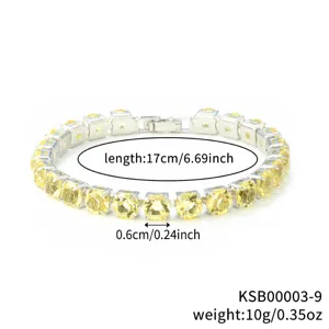 Detailed close-up view of the sparkling yellow rhinestone tennis bracelet link structure.