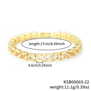 Gold tennis bracelet detail shot showing close-up of sparkling cubic zirconia stones and link.