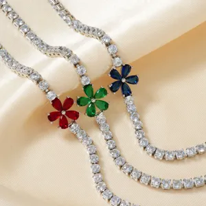 Sparkling silver tennis bracelets with red, green, and blue zirconia flower charms.