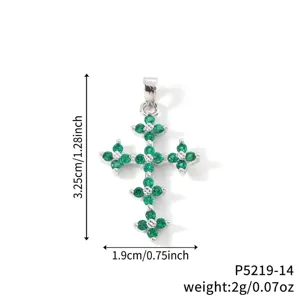 Emerald green zircon cross pendant showing 3.25cm height and 1.9cm width measurements