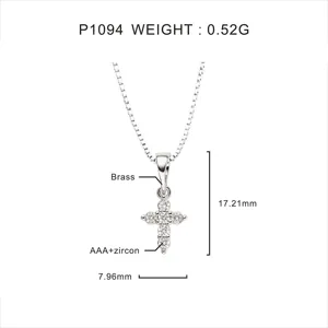 Detailed macro view of a silver cross pendant with AAA zircon and product dimensions.