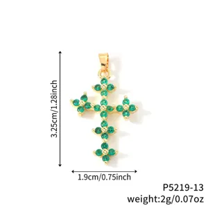 Macro view of gold plated green zircon cross pendant showing precise dimensions and weight
