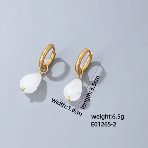 Elegant gold tone hoop earrings with white teardrop stone pendants for stylish everyday wear.